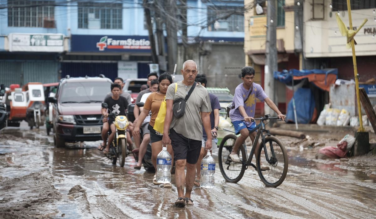 NextImg:Storm-triggered floods in Philippines spark frantic calls to rescue trapped people, some on roofs