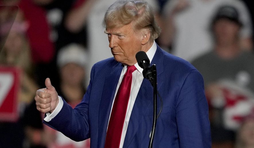 Republican presidential nominee former President Donald Trump gives a thumbs up as he speaks at a campaign event at Mullett Arena, Thursday, Oct. 24, 2024, in Tempe, Ariz. (AP Photo/Matt York)