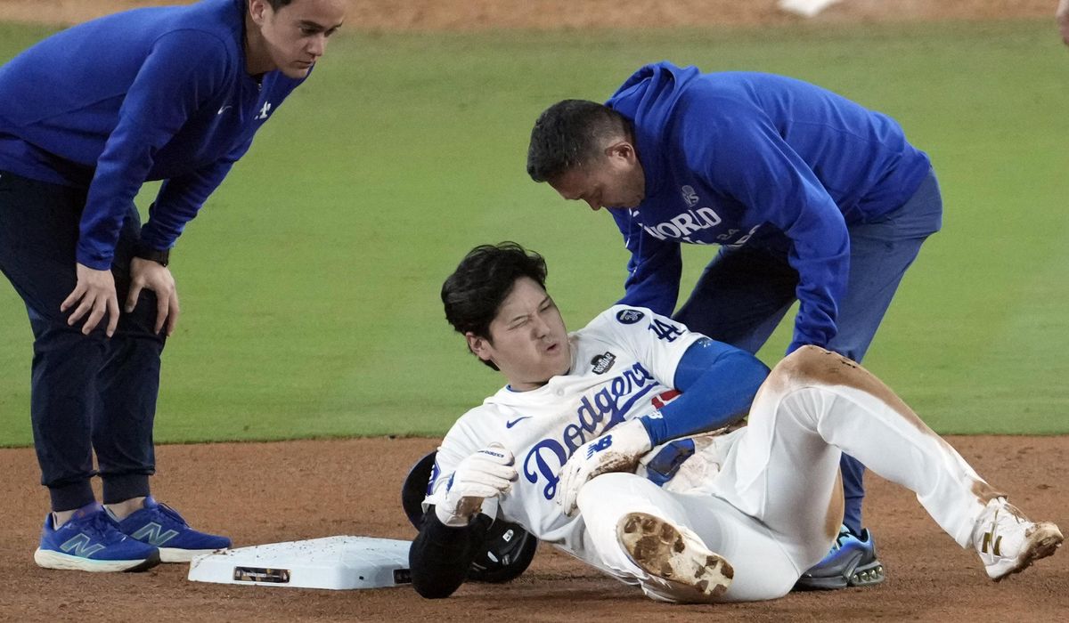 NextImg:Shohei Ohtani injures left arm sliding into second during World Series Game 2, severity uncertain