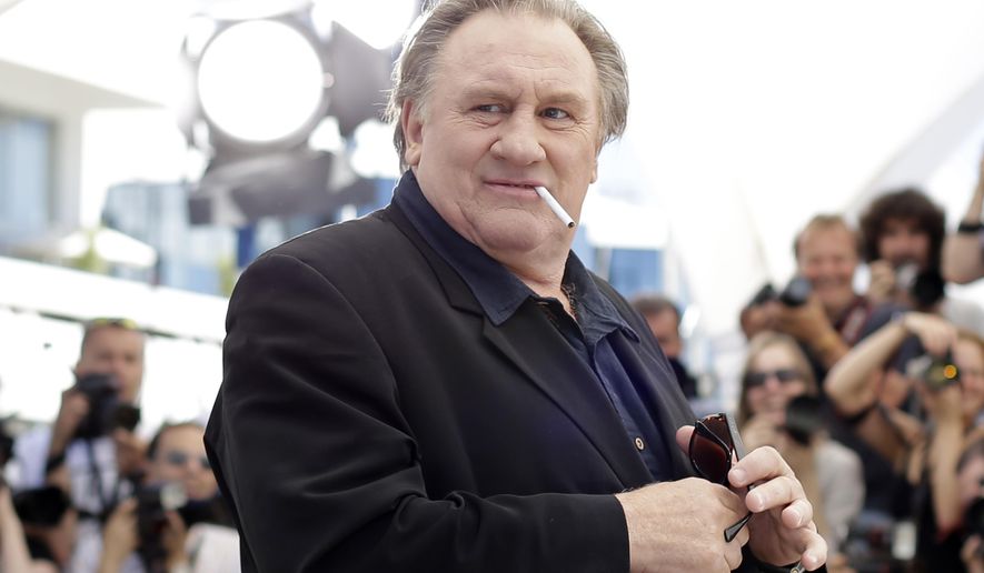 Actor Gerard Depardieu poses for photographers during a photo call for the film Valley of Love, at the 68th international film festival, Cannes, southern France, on May 22, 2015. (AP Photo/Thibault Camus, File)