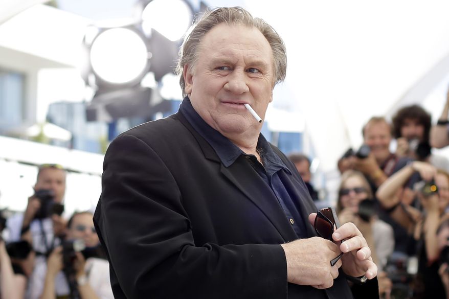 Actor Gerard Depardieu poses for photographers during a photo call for the film Valley of Love, at the 68th international film festival, Cannes, southern France, on May 22, 2015. (AP Photo/Thibault Camus, File)