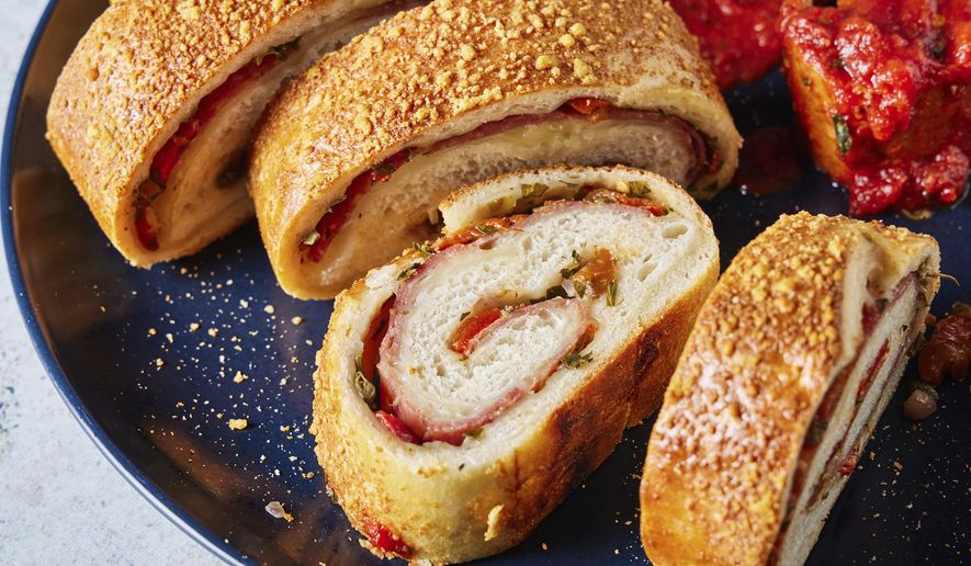 This image released by Milk Street shows a recipe for salami and cheese stromboli . (Milk Street via AP)