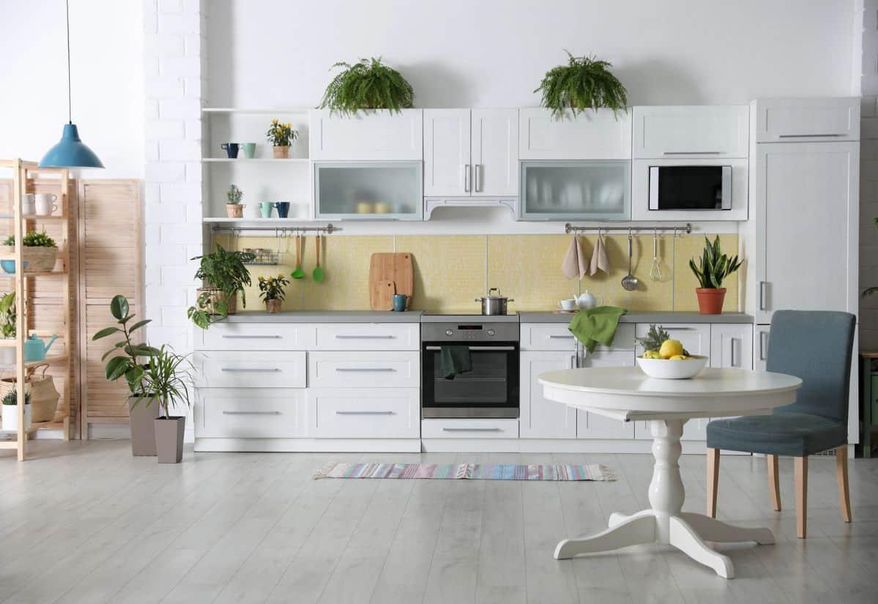 Feeling overwhelmed by kitchen tools? By approaching kitchen organization like a capsule wardrobe, you can reclaim your space. Photo credit: Depositphotos.