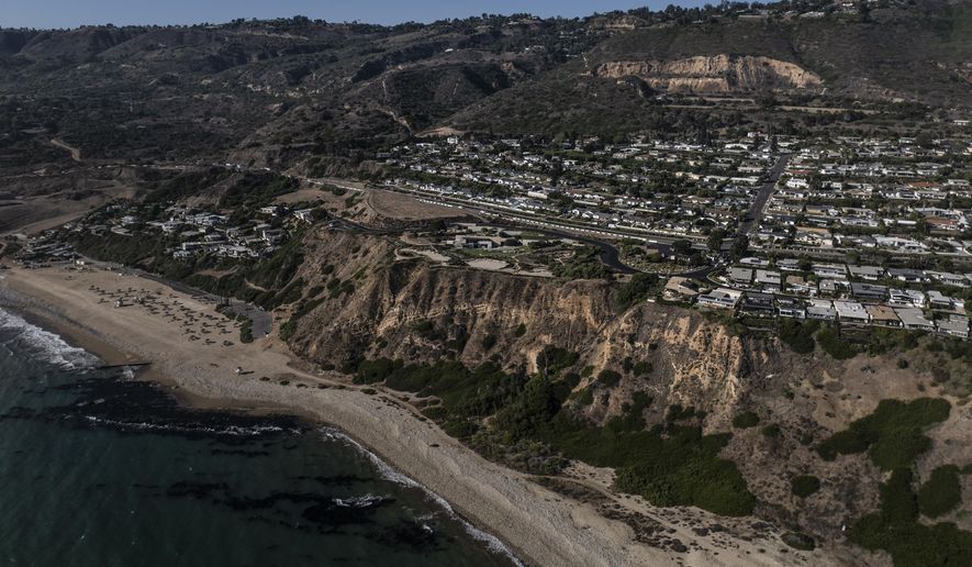 FILE - An aerial view shows a neighborhood affected by ongoing landslides in Rancho Palos Verdes, Calif., Tuesday, Sept. 3, 2024. (AP Photo/Jae C. Hong,File)