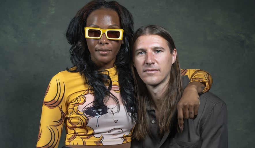 Dawn Richard, left, and Spencer Zahn pose for a portrait to promote the album "Quiet in a World Full of Noise" in Los Angeles on Thursday, Oct. 10, 2024. (AP Photo/Damian Dovarganes)