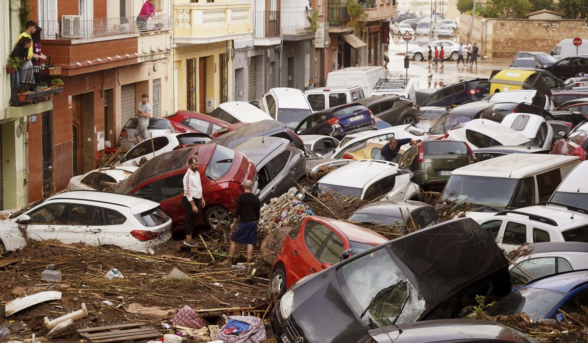 NextImg:At least 63 people die in devastating flash floods in eastern Spain, officials say