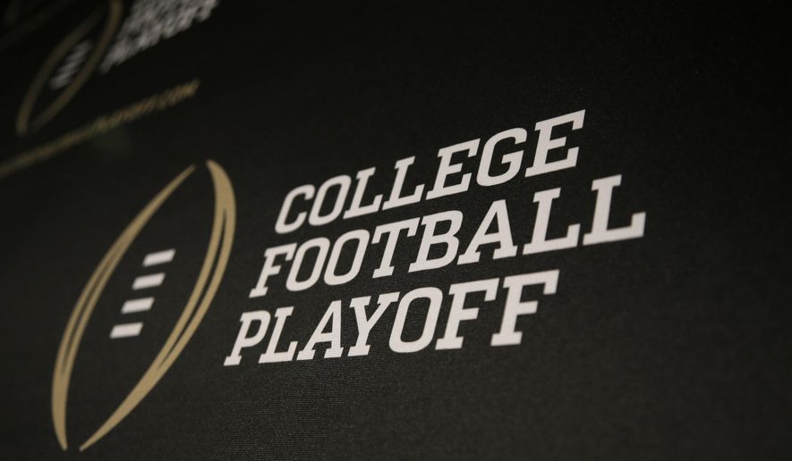 The College Football Playoff logo is printed across a backdrop during a news conference where the 13 members of the committee were announced, Oct. 16, 2013, in Irving, Texas. (AP Photo/Tony Gutierrez, File)