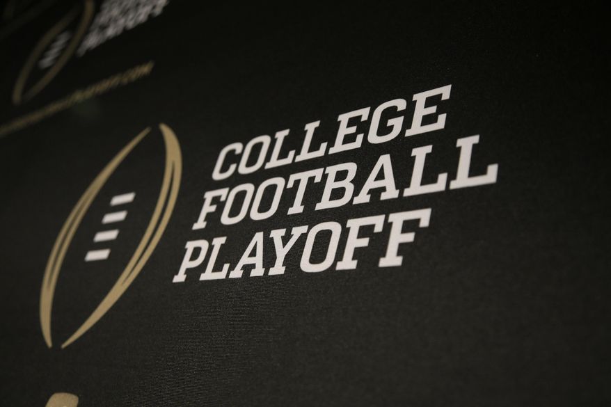 The College Football Playoff logo is printed across a backdrop during a news conference where the 13 members of the committee were announced, Oct. 16, 2013, in Irving, Texas. (AP Photo/Tony Gutierrez, File)