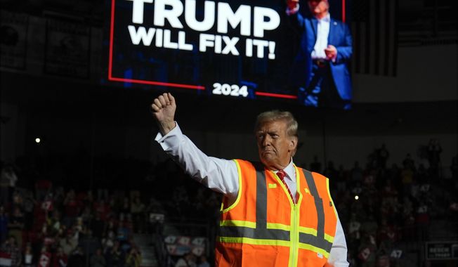 Republican presidential nominee former President Donald Trump gestures after speaking at a campaign rally at Resch Center, Wednesday, Oct. 30, 2024, in Green Bay, Wis. (AP Photo/Julia Demaree Nikhinson)