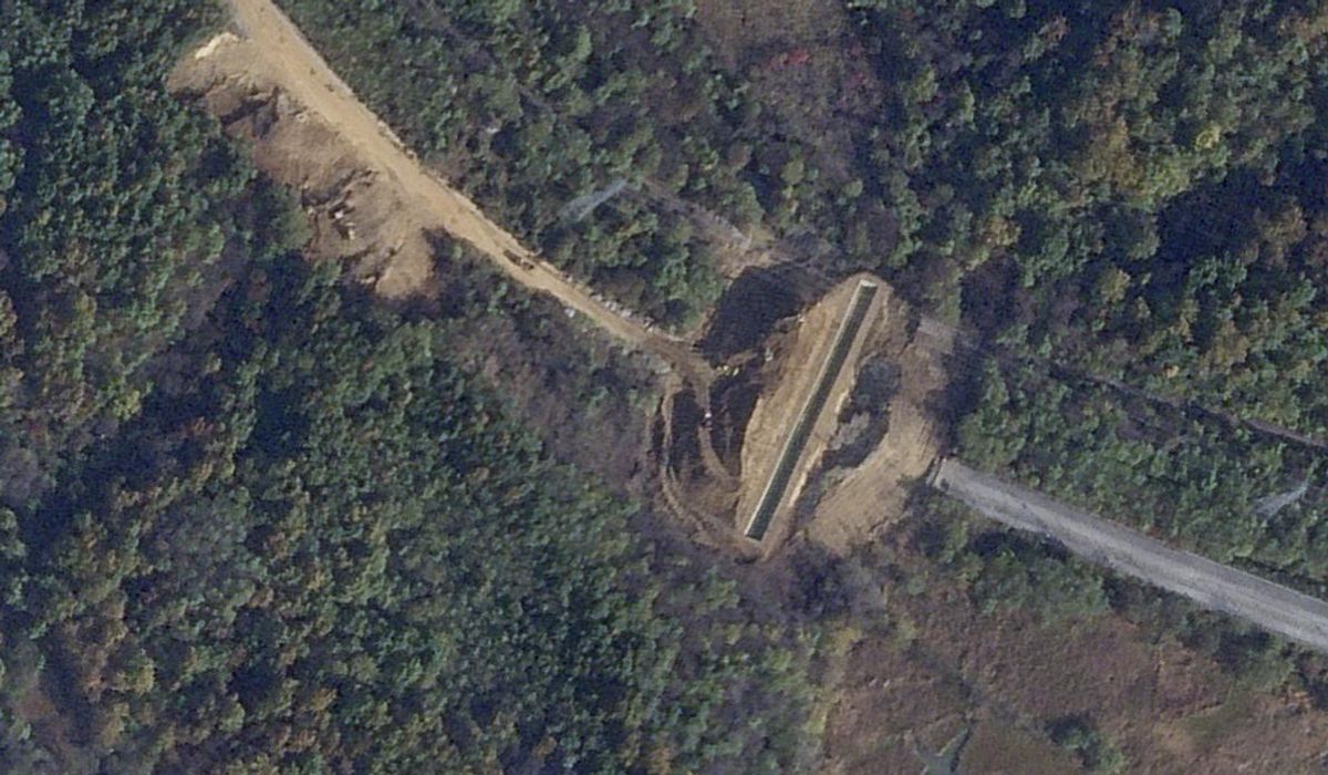 NextImg:Satellite images show North Korea dug large border trenches after demolishing road, rail links