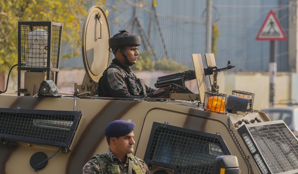 NextImg:A grenade explosion in a busy market in Indian-controlled Kashmir wounds 9