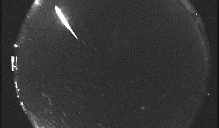 This 2014 image provided by NASA shows a Taurid fireball recorded at the NASA All Sky Fireball Network station in Tullahoma, Tenn. (NASA via AP)
