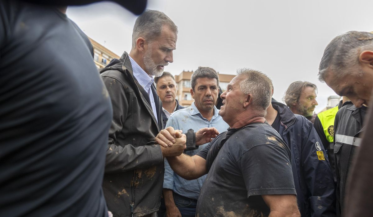 NextImg:Flood survivors pelt Spain’s royals with mud and premier is evacuated during a visit