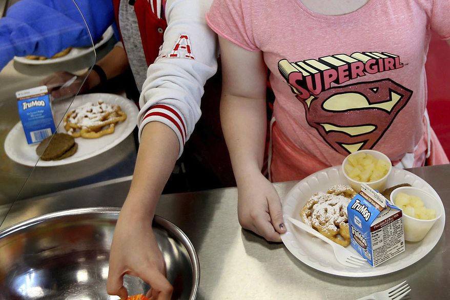 Students line up for lunch at a middle school in Sandy, Utah, May 19, 2017. (Laura Seitz/The Deseret News via AP, File)
