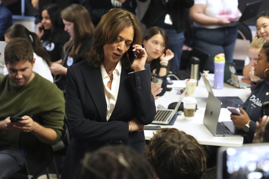 Democratic presidential nominee Vice President Kamala Harris phone banks with volunteers at the DNC headquarters on Election Day, Tuesday, Nov. 5, 2024, in Washington. (AP Photo/Jacquelyn Martin) **FILE**