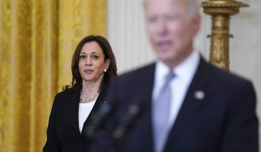 Vice President Kamala Harris listens as President Joe Biden speaks about the distribution of COVID-19 vaccines, in the East Room of the White House, May 17, 2021, in Washington. (AP Photo/Evan Vucci) ** FILE **