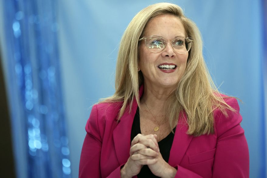 Laura Gillen, Democratic candidate for New York's 4th Congressional District, reacts before a roundtable discussion outlining her policy platform to lower healthcare costs for Latino families, Thursday, Oct. 24, 2024, in Freeport, N.Y. (AP Photo/Heather Khalifa)