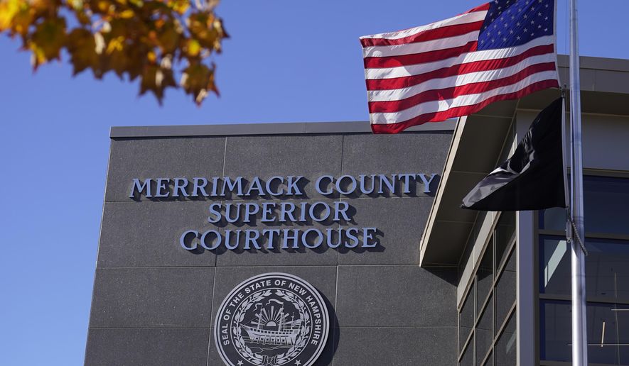 FILE - An American flag flies outside Merrimack County Superior Courthouse in Concord, N.H., Sunday, Oct. 11, 2020. (AP Photo/Charles Krupa, File)