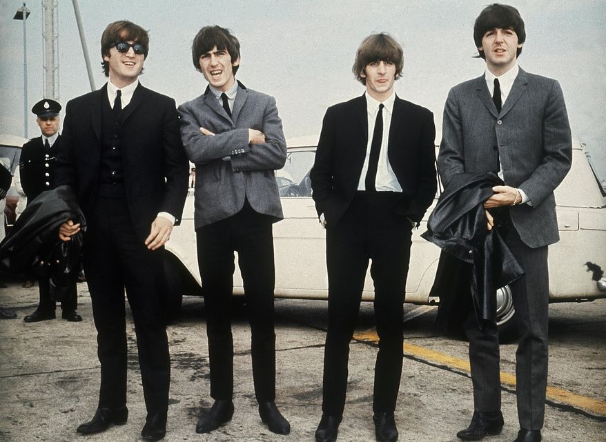 The Beatles, from left, John Lennon, George Harrison, Ringo Starr and Paul McCartney appear in Liverpool, England on July 10, 1964, for the premiere of their movie "A Hard Day's Night." (AP Photo, File)