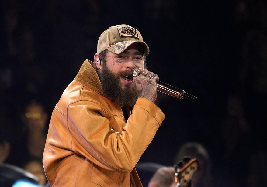 Post Malone performs a medley at the 57th Annual CMA Awards on Wednesday, Nov. 8, 2023, in Nashville, Tenn. (AP Photo/George Walker IV, File)