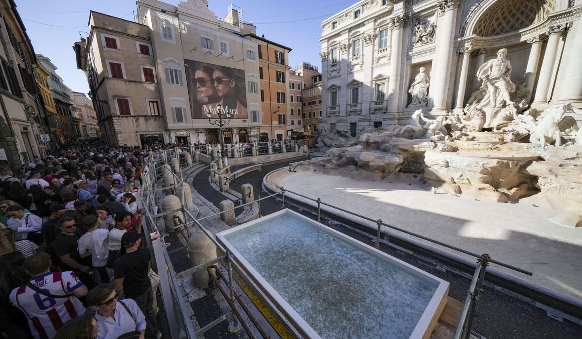 NextImg:Tourists in Rome now have a walkway to visit the Trevi Fountain but can’t toss coins