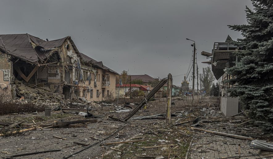 A central streets covered in debris from destroyed residential buildings after Russian bombing in Kurakhove, Donetsk region, Ukraine, on Nov. 7, 2024. (AP Photo/Anton Shtuka)