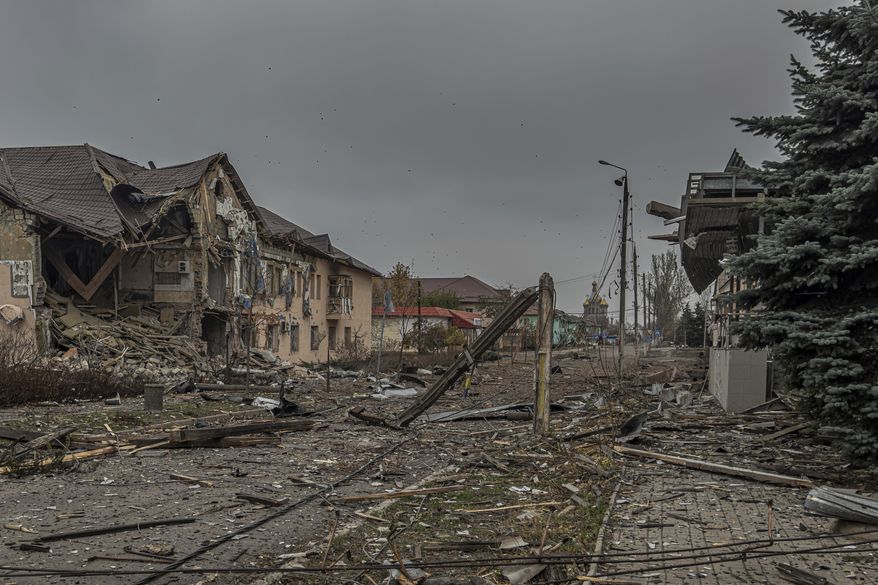 A central streets covered in debris from destroyed residential buildings after Russian bombing in Kurakhove, Donetsk region, Ukraine, on Nov. 7, 2024. (AP Photo/Anton Shtuka)