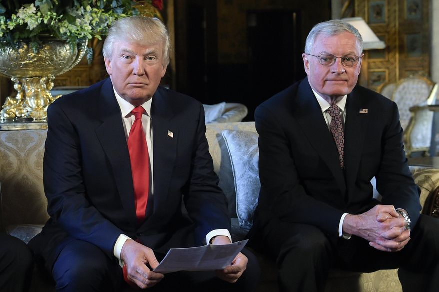 President Donald Trump, center, sits with retired Army Lt. Gen. Keith Kellogg, right, at Trump's Mar-a-Lago estate in Palm Beach, Fla., Feb. 20, 2017. President-elect Donald Trump’s choice for defense secretary is still up in the air, but it’s a sure bet he will look to pick a loyalist following his tumultuous first term. (AP Photo/Susan Walsh, File)