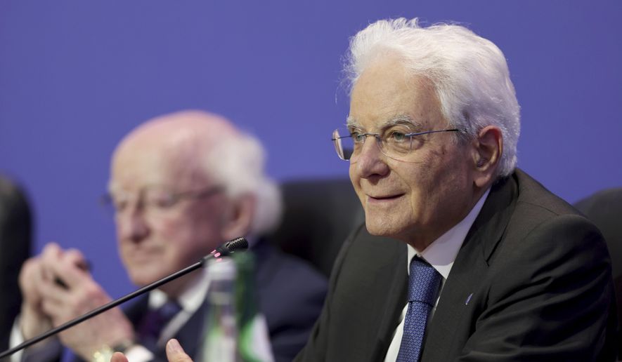 Sergio Mattarella, president of Italy, right, addresses journalists at the end of the Arraiolos Group meeting in Porto, Portugal, Oct. 6, 2023. (AP Photo/Miguel Angelo Pereira, File)