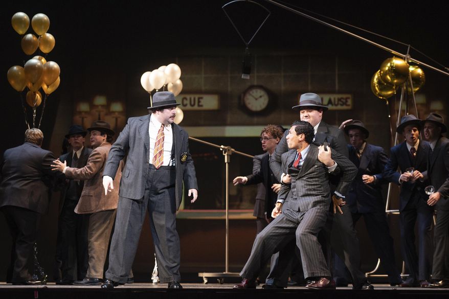 This image released by the University of Indiana shows, from left, Jonathan Elmore, Evan Tiapula, and Cody Home during a rehearsal of “The Amazing Adventures of Kavalier & Clay,” at the Jacobs School of Music on the University of Indiana campus in Bloomington, Ind., on Monday, Nov. 11, 2024. (Sarah J. Slover/University of Indiana via AP)