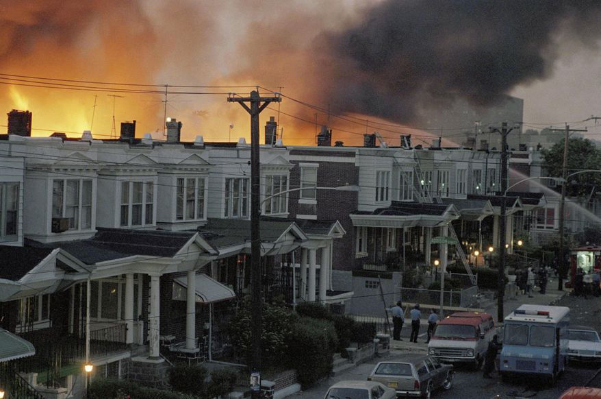 In May of 1985, scores of row houses burn in a fire in the West Philadelphia neighborhood. Police dropped a bomb on the militant group MOVE's home, May 13, 1985, in an attempt to arrest members, leading to the burning of scores of homes in the neighborhood. (AP Photo, File)