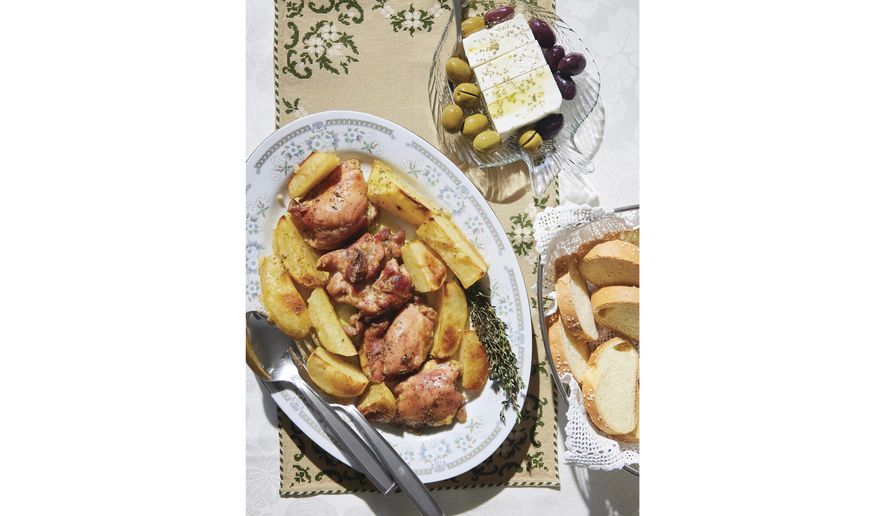 This image released by Harvest shows a recipe for Greek chicken from "The League of Kitchens Cookbook: Brilliant Tips, Secret Methods & Favorite Family Recipes from Around the World" by Lisa Kyung Gross. (Kristin Teig/Harvest via AP)