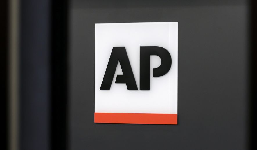 The Associated Press logo is displayed at the company's headquarters on April 18, 2017, in New York. (AP Photo/Jenny Kane, File)