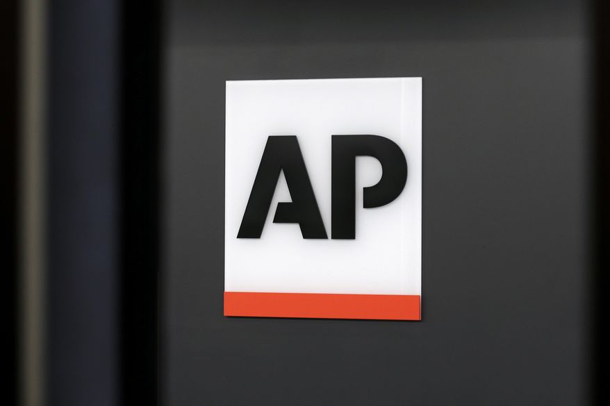 The Associated Press logo is displayed at the company's headquarters on April 18, 2017, in New York. (AP Photo/Jenny Kane, File)