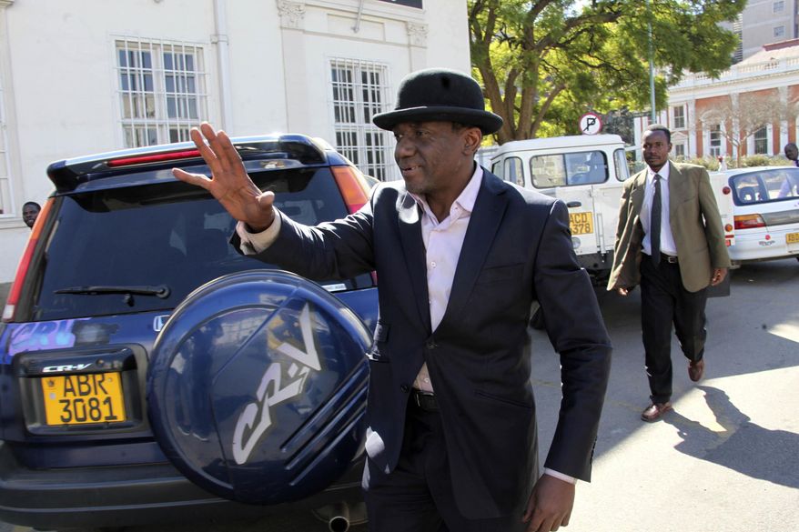 Then-Zimbabwe's minister of state in the Prime Minister's office Jameson Timba, arrives at the High Court in Harare, Sunday, June, 26, 2011. (AP Photo/Tsvangirayi Mukwazhi, File)