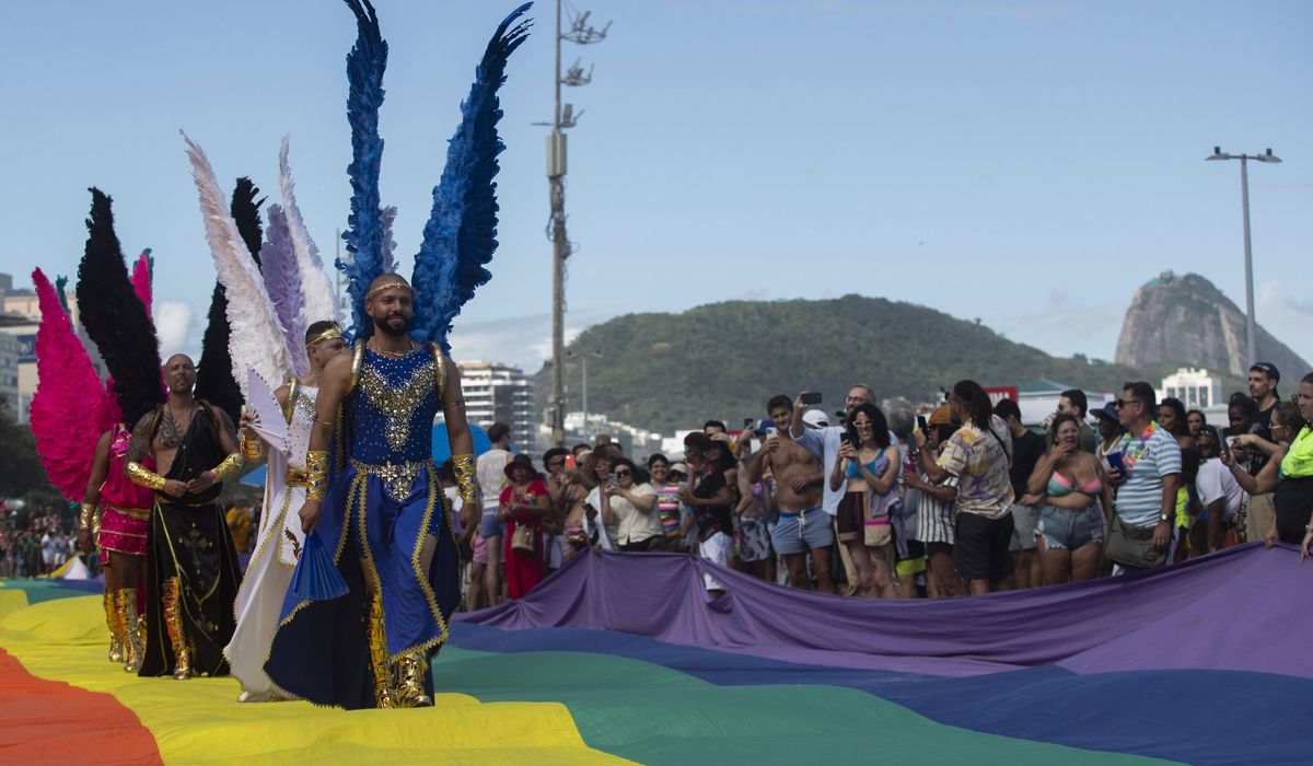 NextImg:Rainbow-laden revelers hit Copacabana beach for Rio de Janeiro’s pride parade