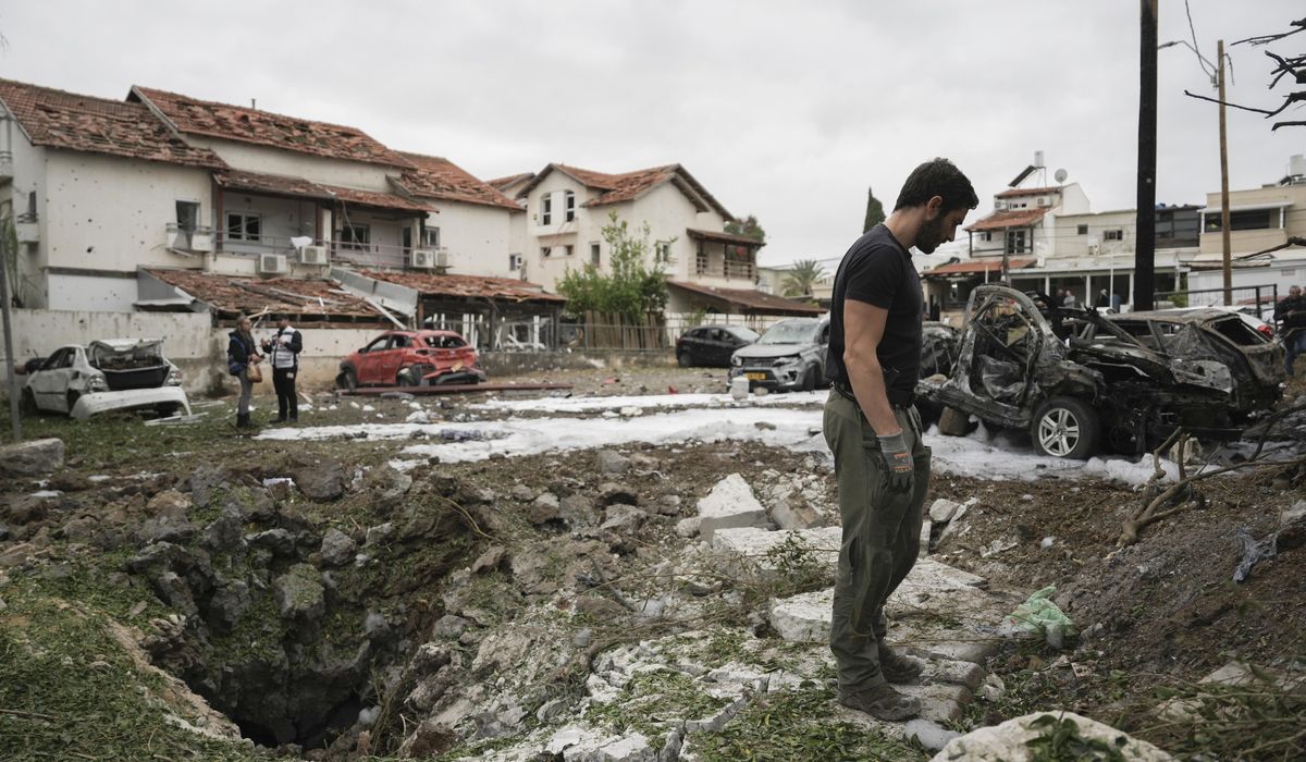 NextImg:Hezbollah fires more than 180 rockets and other projectiles into Israel, wounding at least 7