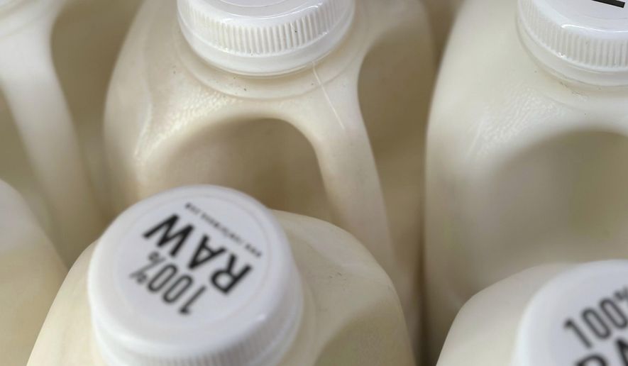 Bottles of raw milk are displayed for sale at a store in Temecula, Calif., on Wednesday, May 8, 2024. (AP Photo/JoNel Aleccia, file)