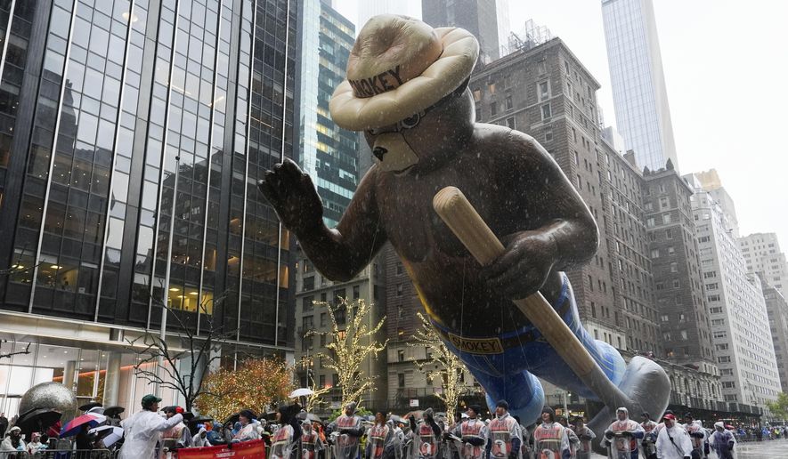 Handlers guide the Smokey Bear balloon down Sixth Avenue during the Macy's Thanksgiving Day Parade, Thursday, Nov. 28, 2024, in New York. (AP Photo/Julia Demaree Nikhinson) ** FILE **
