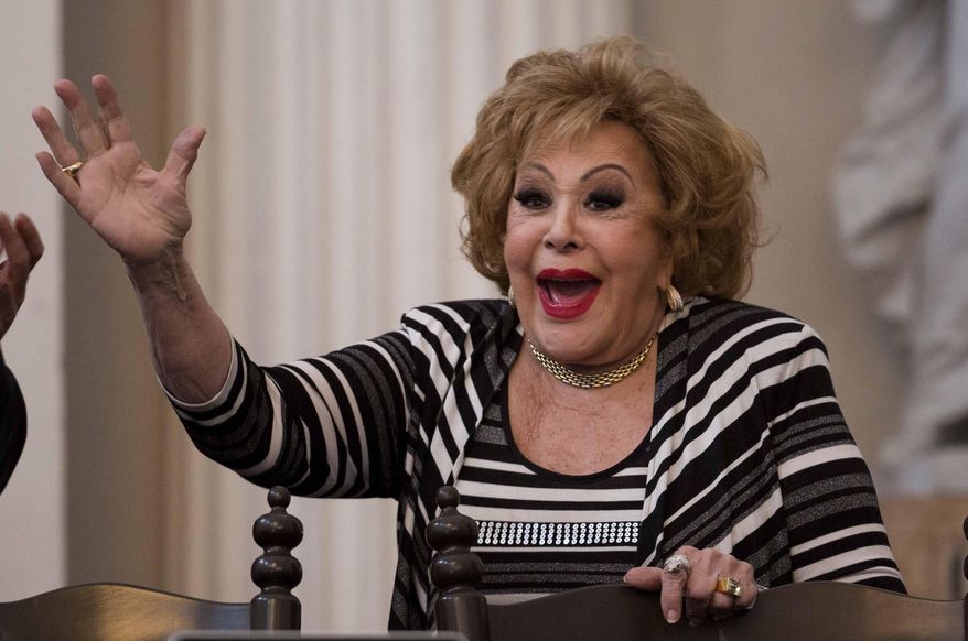 Mexican actress Silvia Pinal smile during the presentation the her book "Esta Soy Yo," or This is me, at the Palacio de Mineria International Book Fair in Mexico City, on Feb. 19, 2016. (AP Photo/Eduardo Verdugo, File)