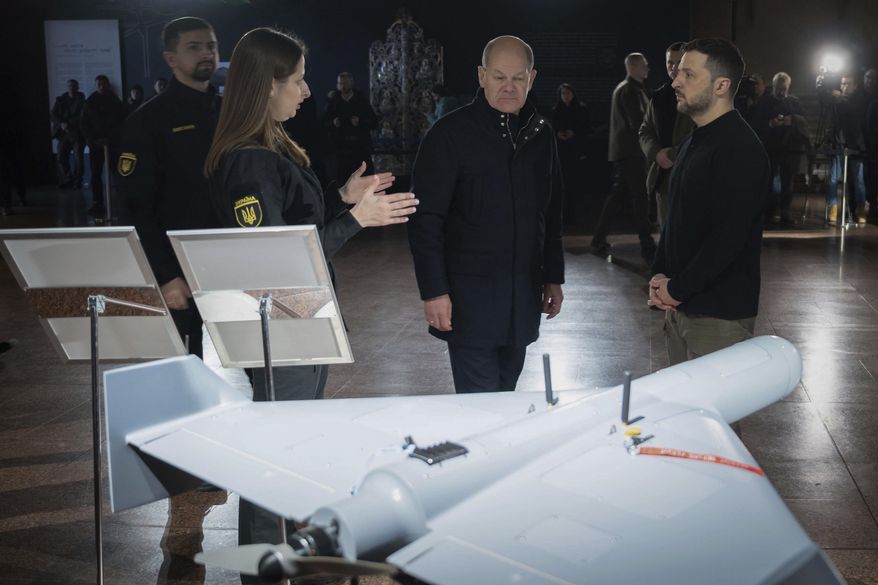 In this photo provided by the Ukrainian Presidential Press Office, Ukraine's President Volodymyr Zelenskyy, front right, and German Chancellor Olaf Scholz, front second right, take a look at drones during Scholz's visit to Kyiv, Ukraine, Monday, Dec. 2, 2024. (Ukrainian Presidential Press Office via AP) **FILE**