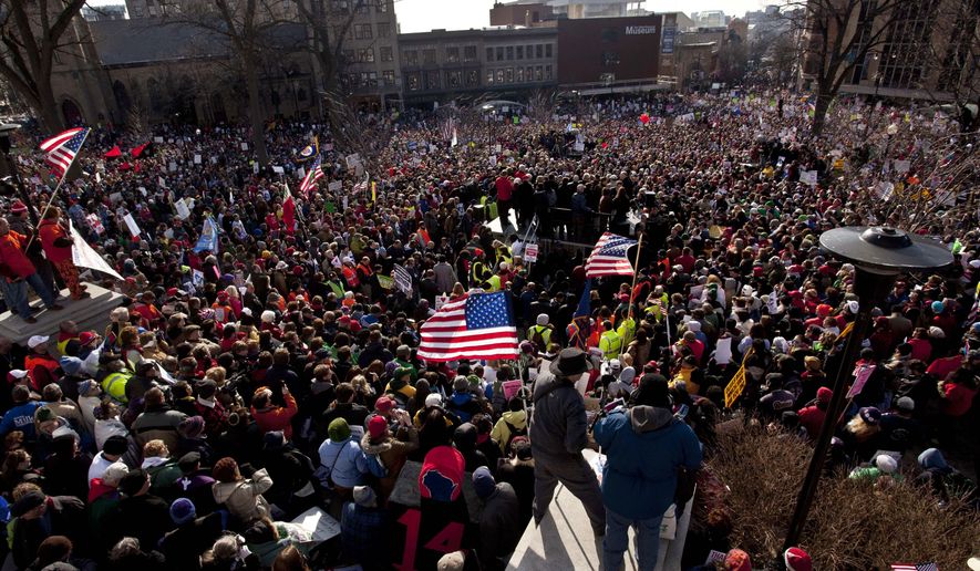 In this March 12, 2011, photo, thousands of pro-labor protesters rallied at the Wisconsin Capitol in Madison, Wis. (AP Photo/Morry Gash, File)