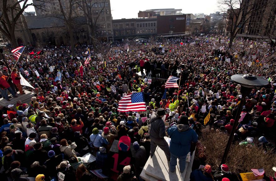 In this March 12, 2011, photo, thousands of pro-labor protesters rallied at the Wisconsin Capitol in Madison, Wis. (AP Photo/Morry Gash, File)