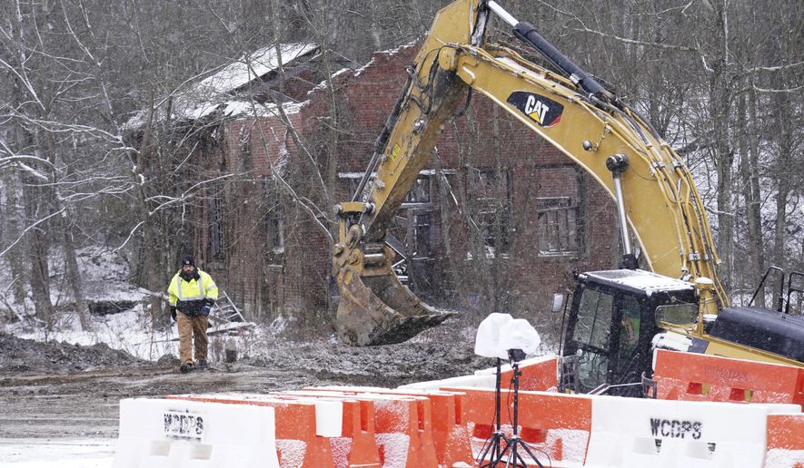 Rescue workers continue to search, Thursday, Dec. 5, 2024, for Elizabeth Pollard, who is believed to have disappeared in a sinkhole while looking for her cat, in Marguerite, Pa. (AP Photo/Matt Freed)