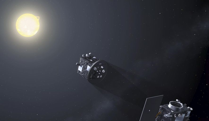 This image provided by the European Space Agency shows a pair of probes creating an artificial total solar eclipse through formation flying. (European Space Agency via AP)