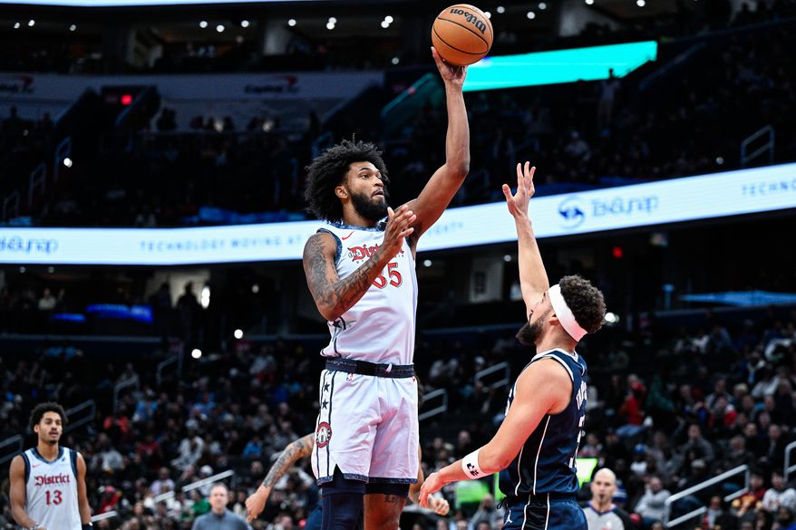 Washington Wizards center Marvin Bagley III (35) shoots over Dallas Mavericks guard Klay Thompson (31) during the third quarter at Capital One Arena, Washington, D.C., December 5, 2024. (Photo by Brian Murphy for the Washington Times)