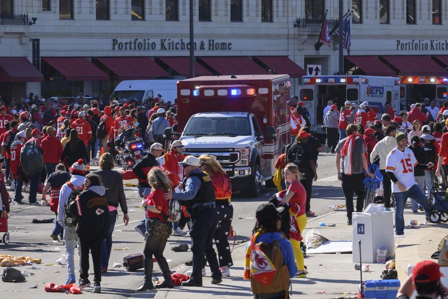 Police clear the area following a shooting at the Kansas City Chiefs NFL football Super Bowl celebration in Kansas City, Mo., Feb. 14, 2024. (AP Photo/Reed Hoffmann, File)