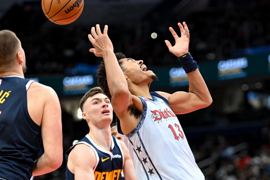 Washington Wizards guard Jordan Poole (13) reacting after getting hit with the ball during the fourth quarter of an NBA game against the Denver Nuggets at Capital One Arena in Washington D.C., December 7, 2024. (Photo for the Washington Times)