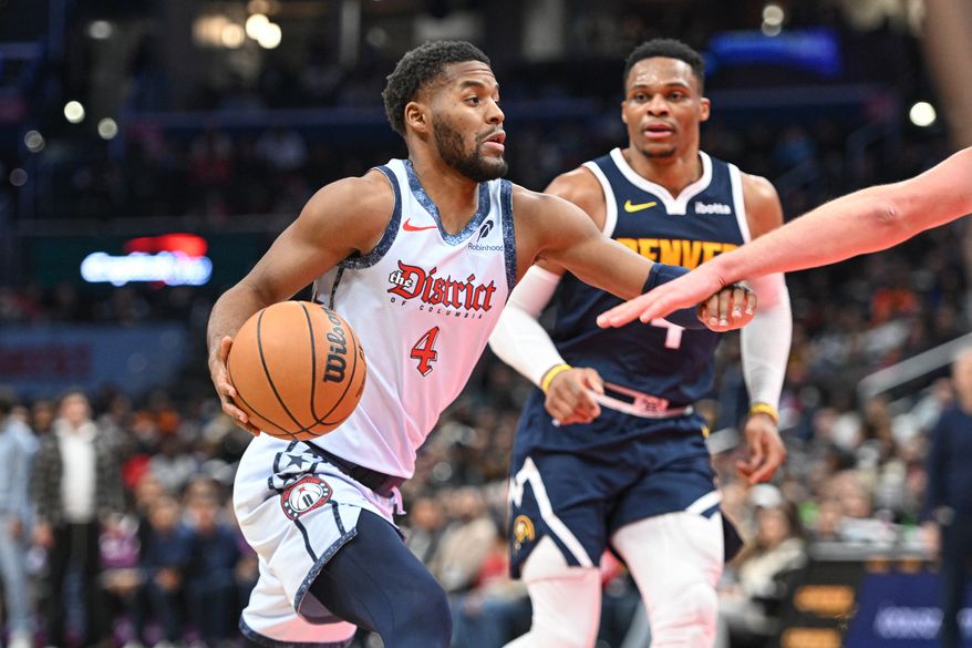 Washington Wizards guard Jared Butler (4) driving towards the hoop during the fourth quarter of an NBA game against the Denver Nuggets at Capital One Arena in Washington D.C., December 7, 2024. (Photo for the Washington Times)