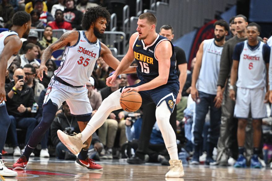 Denver Nuggets center Nikola Jokic (15) dribbling the ball during the fourth quarter of an NBA game against the Washington Wizards at Capital One Arena in Washington D.C., December 7, 2024. (Photo for the Washington Times)